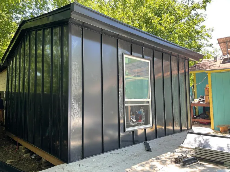 Black standing seam metal wall panels for Roof Inspection in Joshua